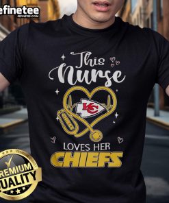 Happy nurse wearing a Kansas City Chiefs t-shirt, showcasing team spirit and love for football.