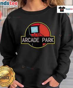 Nice Arcade Park X Jurassic Park sweatshirt featuring vibrant graphics and a cozy fit, perfect for fans of retro gaming.