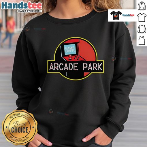 Nice Arcade Park X Jurassic Park sweatshirt featuring vibrant graphics and a cozy fit, perfect for fans of retro gaming.