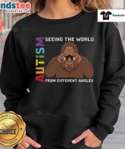 Cozy sweatshirt featuring Bigfoot and binoculars, celebrating autism and seeing the world from different angles.