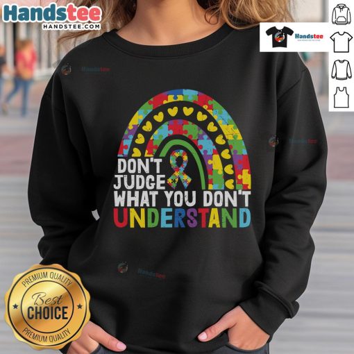 Autism Awareness sweatshirt featuring a rainbow puzzle piece and the phrase 'Don't Judge What You Don't Understand.'