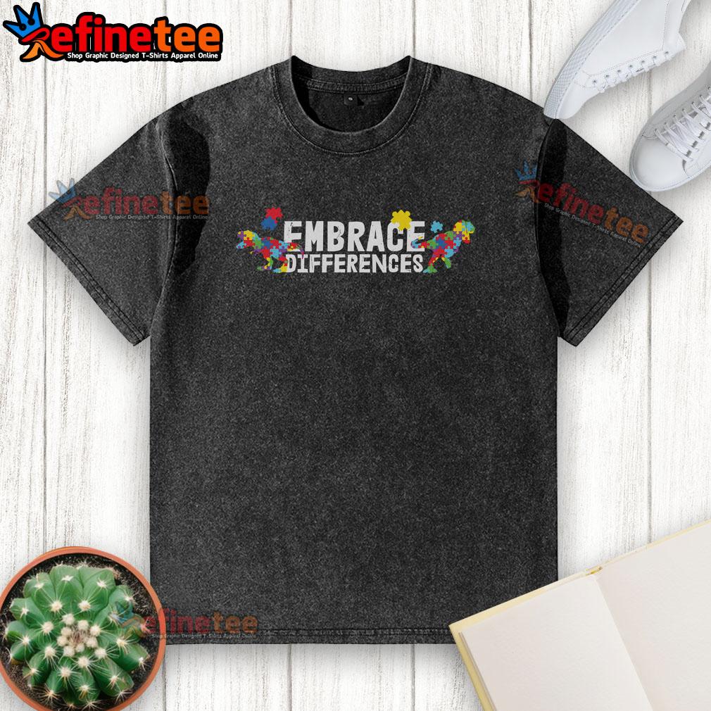 Nice Embrace Differences Autism Awareness Puzzle Dinosaur Washed T Shirt Colorful washed t-shirt featuring a dinosaur puzzle design promoting autism awareness and embracing differences.