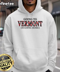 Cozy 'Nice Going to Vermont is Going Home' hoodie in a scenic outdoor setting, perfect for Vermont lovers and travelers.