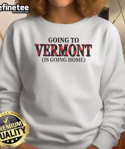Cozy 'Nice Going to Vermont is Going Home' sweatshirt displayed on a rustic wooden background, perfect for travelers.