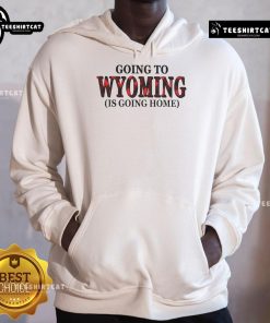 Cozy 'Nice Going To Wyoming Is Going Home' hoodie in a scenic outdoor setting, perfect for Wyoming enthusiasts.