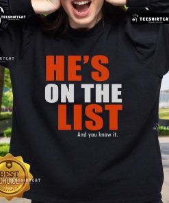 Cozy 'Nice, He's on the List and You Know It' sweatshirt, perfect for holiday gatherings and festive fashion.