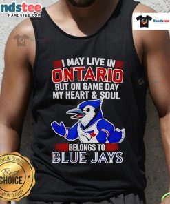 Woman wearing a Toronto Blue Jays tank top showing team spirit, saying 'My heart belongs to the Toronto Blue Jays'.
