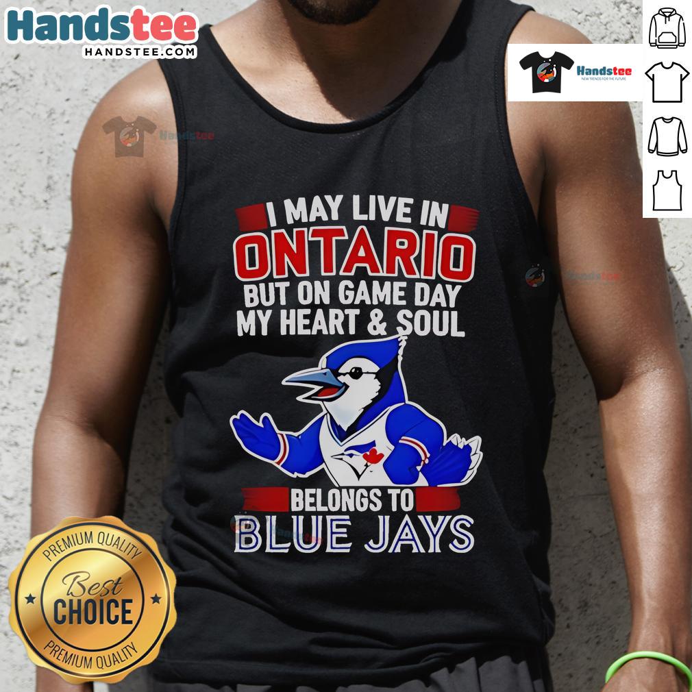 Nice I May Live In Ontario But On Game Day My Heart And Soul Belongs To The Toronto Blue Jays Tank Top Woman wearing a Toronto Blue Jays tank top showing team spirit, saying 'My heart belongs to the Toronto Blue Jays'.