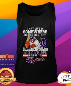 Woman wearing a Detroit Tigers tank top, showcasing her passion for the team on game day.