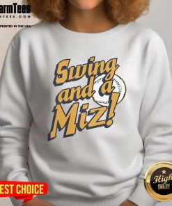 Nice Jacob Misiorowski of the Milwaukee Brewers swinging in a Miz sweatshirt, showcasing team spirit and athleticism.