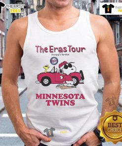 Woman wearing a Minnesota Twins Eras Tour Snoopy tank top at a baseball game, showcasing team spirit and style.