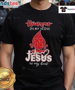 Nice Nebraska Husker In My Veins Jesus In My Heart T-Shirt featuring bold graphics and vibrant colors, perfect for fans.