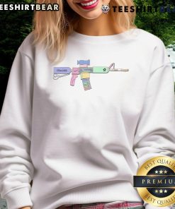 Alt Text: Colorful pen and crayon stockpile with a stylish gun sweatshirt, perfect for creative enthusiasts and artists.