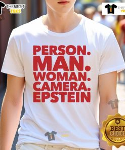 Nice person wearing Epstein T-shirt, posing for the camera with a cheerful smile in a casual outdoor setting.