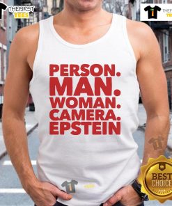 Friendly man and woman posing for a photo in tank tops, showcasing vibrant smiles and a camera, capturing joyful moments.