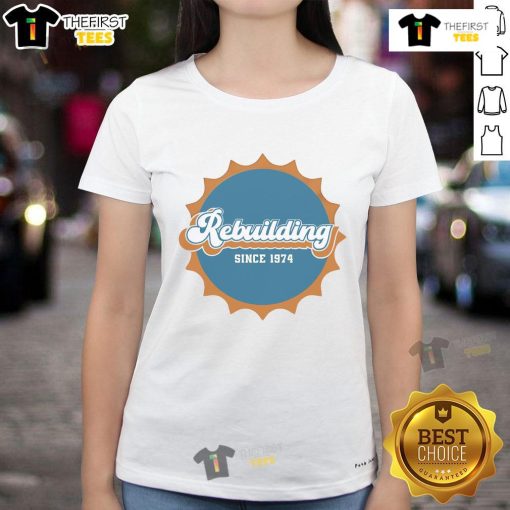 Nice Rebuilding Since 1974 Dolphins Logo Ladies Tee featuring a vibrant team logo on a stylish women's shirt.