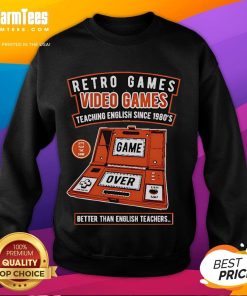 Cozy sweatshirt design featuring retro video games, promoting fun English learning since the 1980s, better than teachers.