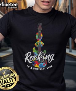 Nice Rocking To A Different Tune Autism Guitar Puzzle T-Shirt featuring a colorful guitar and puzzle pieces design.