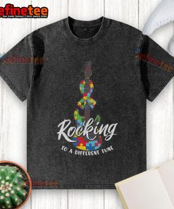Nice Rocking to a Different Tune Autism Guitar Puzzle Wash T-Shirt featuring vibrant colors and a fun guitar design.