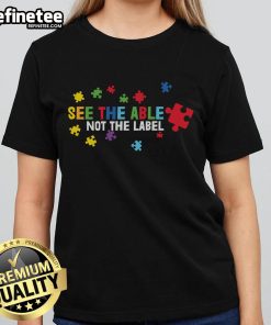 Colorful puzzle piece design on 'Nice See The Able Not The Label' Autism Awareness ladies tee, promoting inclusivity.