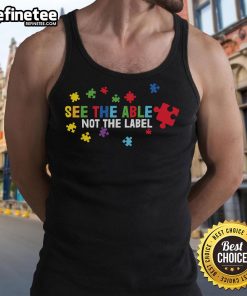 Colorful puzzle piece tank top promoting autism awareness with the slogan See the Able, Not the Label.