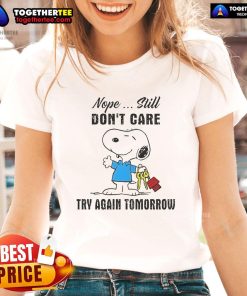 Alt Text: Snoopy 'Nope, Still Don't Care, Try Again Tomorrow' graphic on a ladies tee, perfect for casual wear and Snoopy fans.