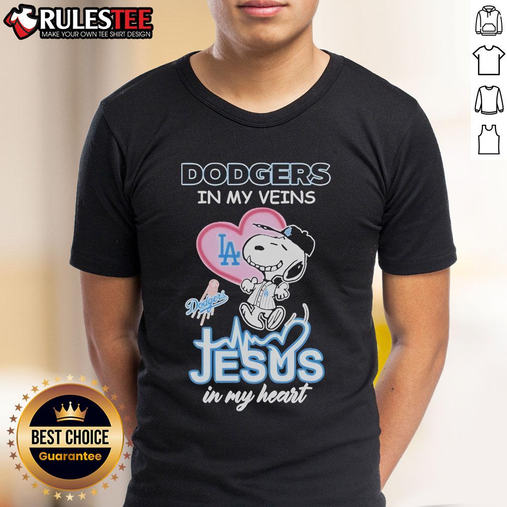Nice Snoopy The Peanuts Los Angeles Dodgers In My Veins Jesus In My Heart T-Shirt Nice Snoopy The Peanuts Los Angeles Dodgers shirt with 'In My Veins Jesus In My Heart' text, perfect for fans.
