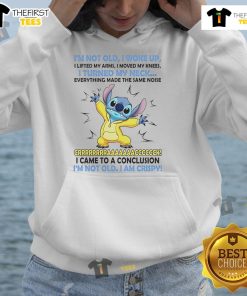 Alt Text: Cozy I'm Not Old, I Woke Up, I Lifted My Arms hoodie with a stylish stitch design, perfect for casual wear.