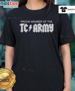 Tom Caron proudly wearing a TC Army Metal Ladies Tee, showcasing team spirit and stylish design.