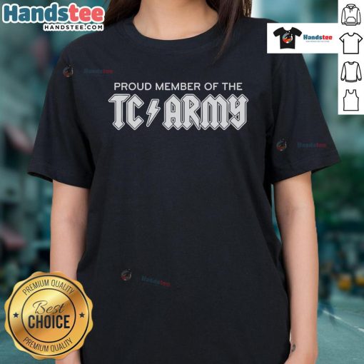 Tom Caron proudly wearing a TC Army Metal Ladies Tee, showcasing team spirit and stylish design.