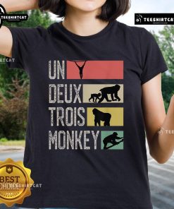 Stylish Nice Un Deux Trois Monkey Ladies Tee featuring playful monkey graphics on a vibrant background.