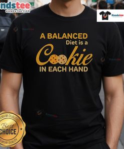 Alt Text: Official A Balanced Diet Is A Cookie In Each Hand T-Shirt featuring a fun graphic design and playful slogan.