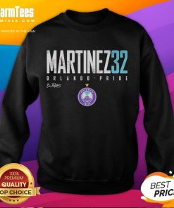 Brianna Martinez wearing Orlando Pride Elite sweatshirt, showcasing vibrant colors and logo at a pride event.