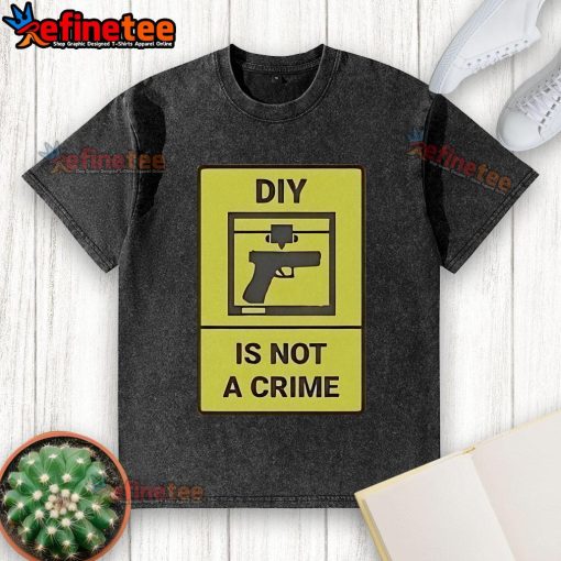 Official DIY Is Not A Crime washed t-shirt displayed on a hanger, showcasing its unique design and casual style.