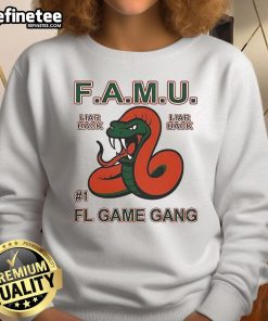 Alt Text: Official F.A.M.U. Liar Back FL Game Gang Rattle The Game Sweatshirt featuring bold graphics and a comfortable fit.