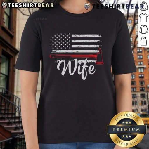 Official Firefighter Wife tee featuring America flag and fire axe design for proud firefighter spouses.