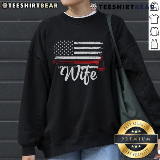 Alt Text: Official Firefighter Wife America Flag Fire Axe Sweatshirt design featuring a bold graphic and patriotic colors.