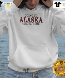 Official Going To Alaska Is Going Home Hoodie in a cozy outdoor setting, showcasing its unique design and vibrant colors.