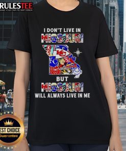 Ladies tee featuring 'I Don't Live In Missouri But Missouri Will Always Live In Me' with sports team graphics.