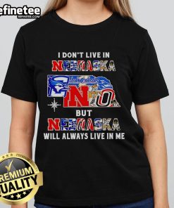 Official 'I Dont Live in Nebraska but Nebraska Will Always Live in Me' ladies tee featuring sport teams design.