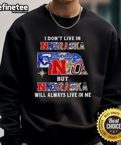 Official 'I Dont Live In Nebraska But Nebraska Will Always Live In Me' sweatshirt for sports fans, showcasing Nebraska pride.