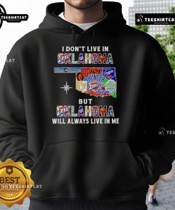 Alt Text: Official I Don't Live In Oklahoma But Oklahoma Will Always Live In Me hoodie featuring sport team logos and vibrant design.