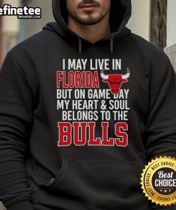 Person wearing 'I May Live In Florida But On Game Day My Heart And Soul Belongs To The Bulls' hoodie, showcasing team pride.