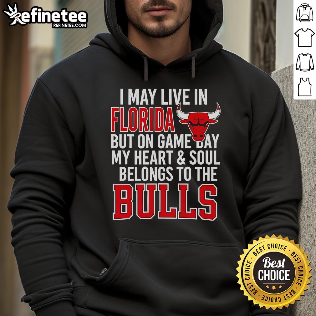 Official I May Live In Florida But On Game Day My Heart And Soul Belongs To The Bulls Hoodie Person wearing 'I May Live In Florida But On Game Day My Heart And Soul Belongs To The Bulls' hoodie, showcasing team pride.