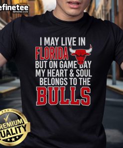 Alt Text: Official I May Live In Florida But On Game Day My Heart And Soul Belongs To The Bulls T-Shirt design showcased.