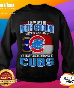 Cozy sweatshirt featuring 'I May Live In North Carolina But On Gameday My Heart Belongs To Chicago Cubs' design.