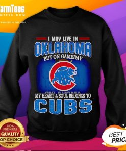 Cozy sweatshirt featuring 'I May Live In Oklahoma But On Gameday My Heart Belongs To Chicago Cubs' design.