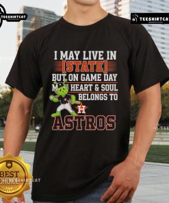 Official I May Live In State But On Game Day My Heart And Soul Belongs To The Houston Astros T-Shirt displayed on a hanger.