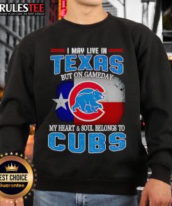 Official I May Live In Texas But On Gameday My Heart And Soul Belongs To Chicago Cubs Sweatshirt displayed on a hanger.