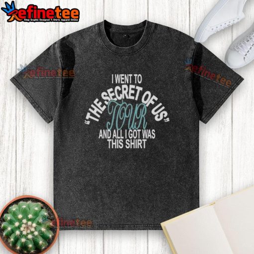 Official I Went To Secret Of Us Tour washed t-shirt displayed on a hanger, showcasing vibrant design and tour details.